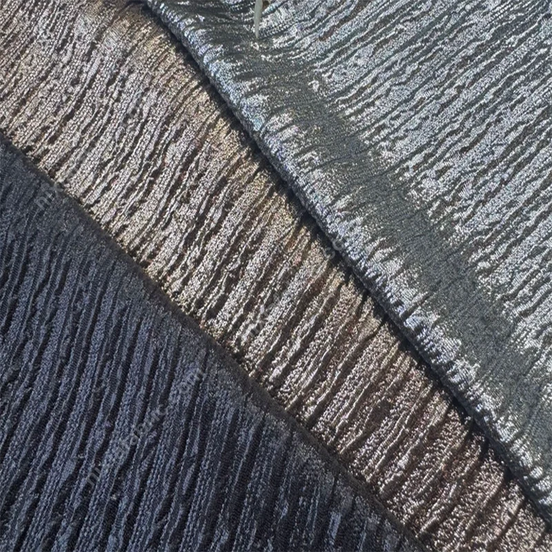 Double-layer pleated foil knit fabric detail showing vertical texture