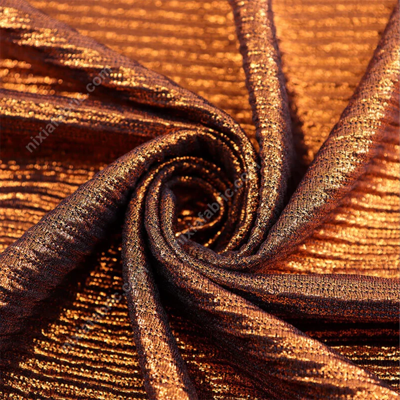 Double-layer foil knit fabric showing pleated texture and structured shine