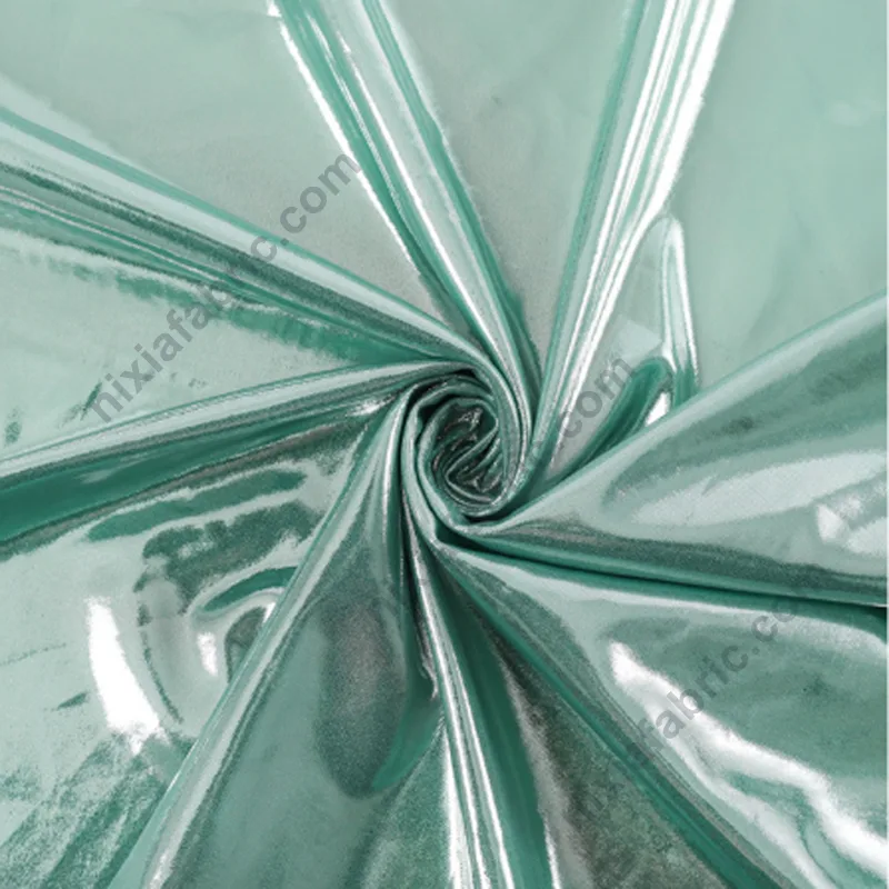 Reflective shiny foil knit fabric showing flexible drape for dancewear