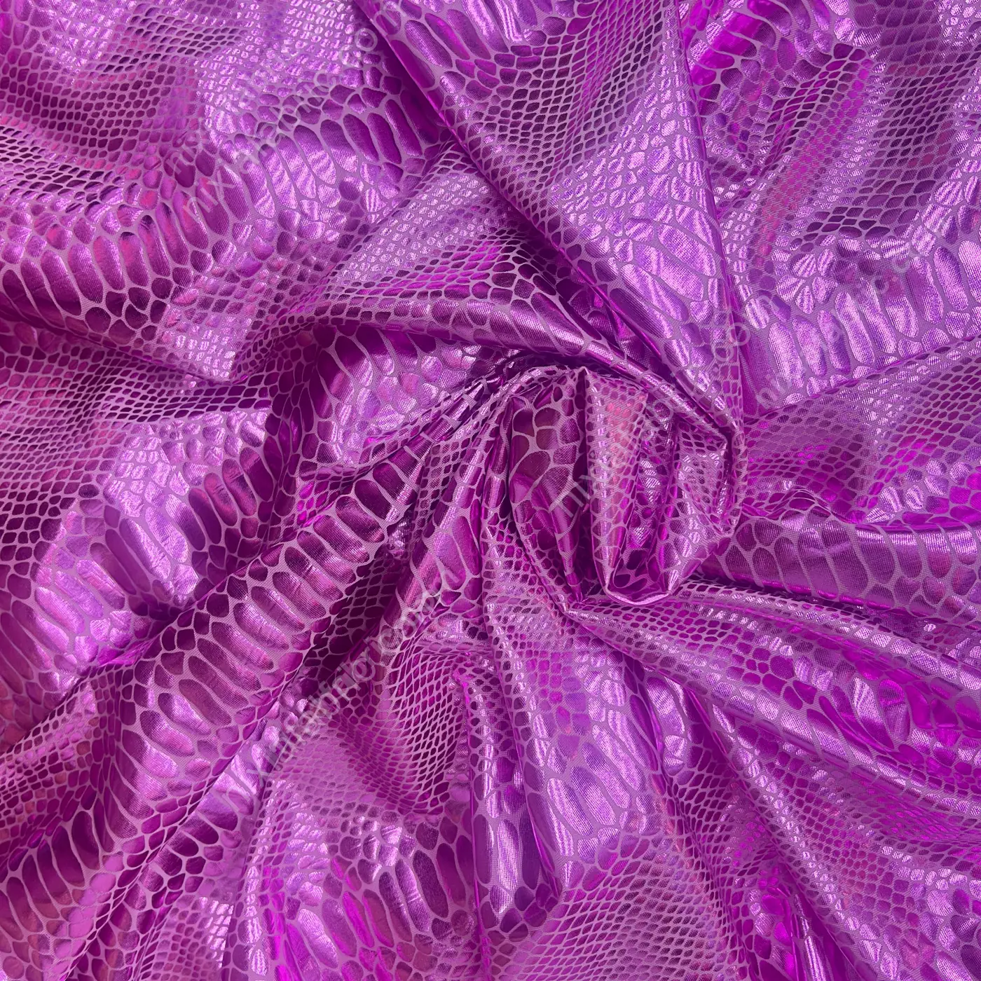 Close-up of holographic laser foil snakeskin texture on stretch fabric