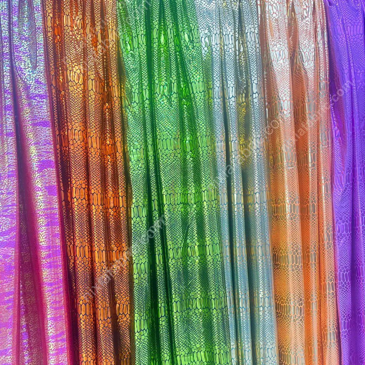 Reflective snakeskin foil fabric surface for swimwear and leggings