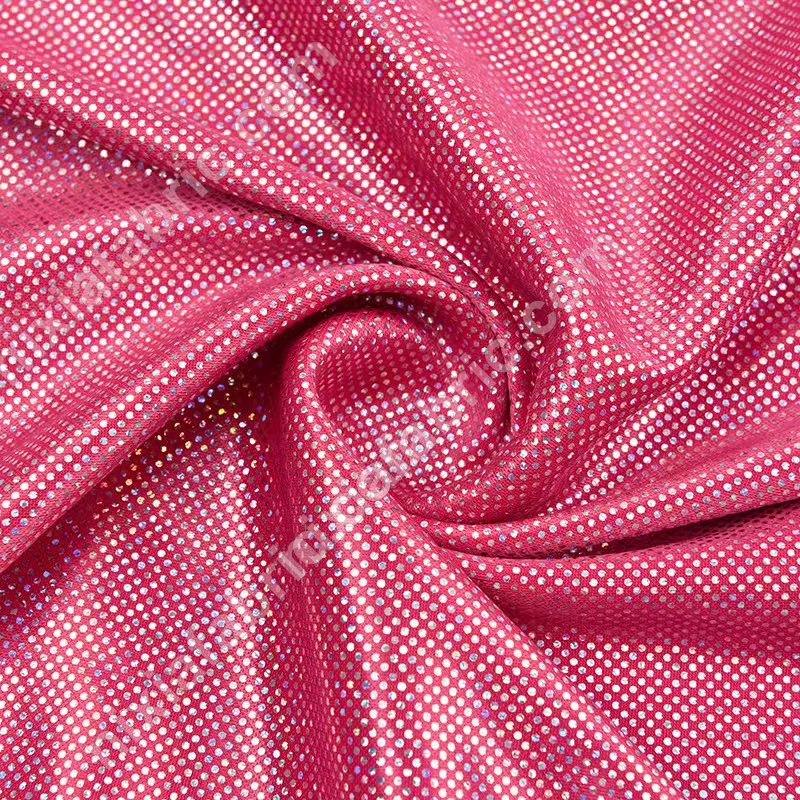 Close-up of slight stretch knit fabric with rainbow dot foil effect