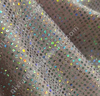 Lightweight rainbow dot foil fabric close-up for costume production