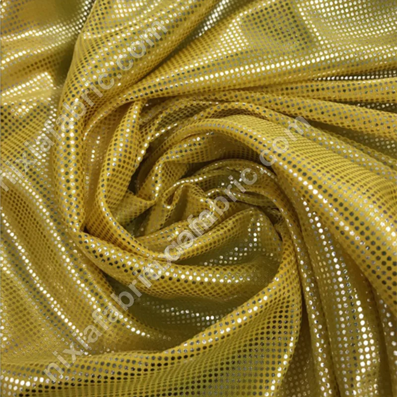Yellow rainbow dot laser foil knit fabric drape and shine for stagewear