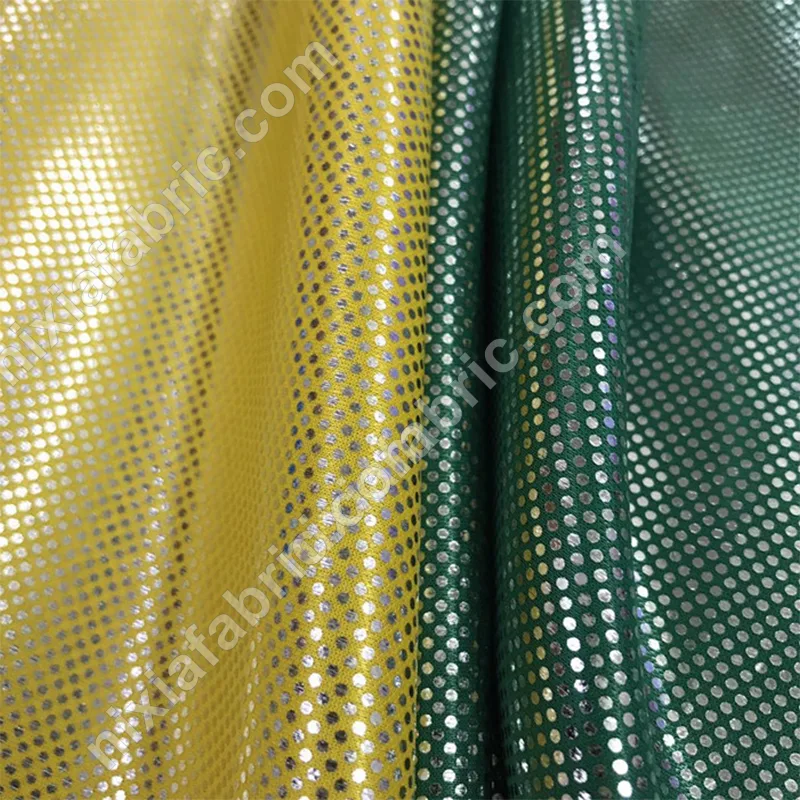Green and yellow rainbow dot laser foil knit fabric surface detail