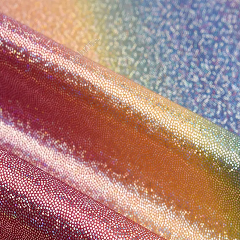 Gradient rainbow dot foil knit fabric detail showing reflective dot surface