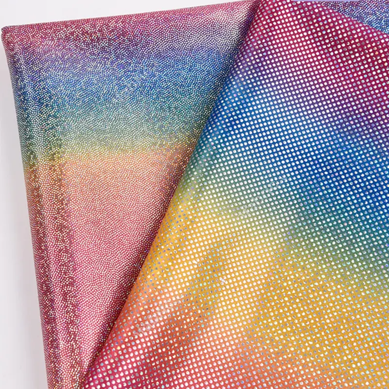 Reflective gradient dot foil fabric surface for dancewear panels