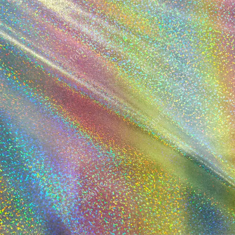 Close-up of gradient rainbow dot foil knit fabric with reflective dot pattern