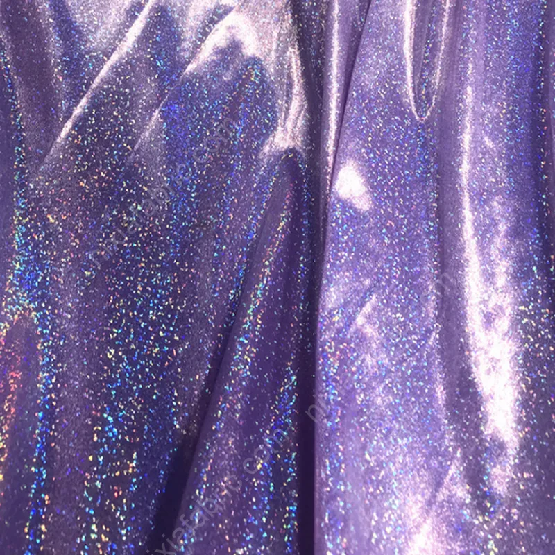 Close-up of 4-way stretch knit fabric with rainbow fingerprint dot foil effect