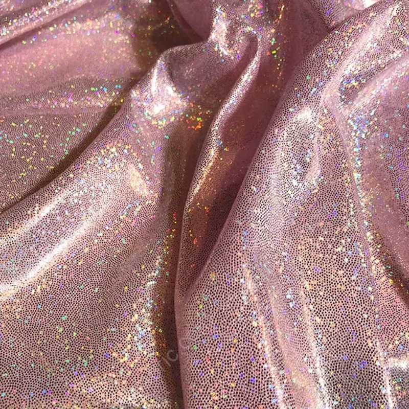 Close-up of rainbow fingerprint dot foil stretch knit fabric surface