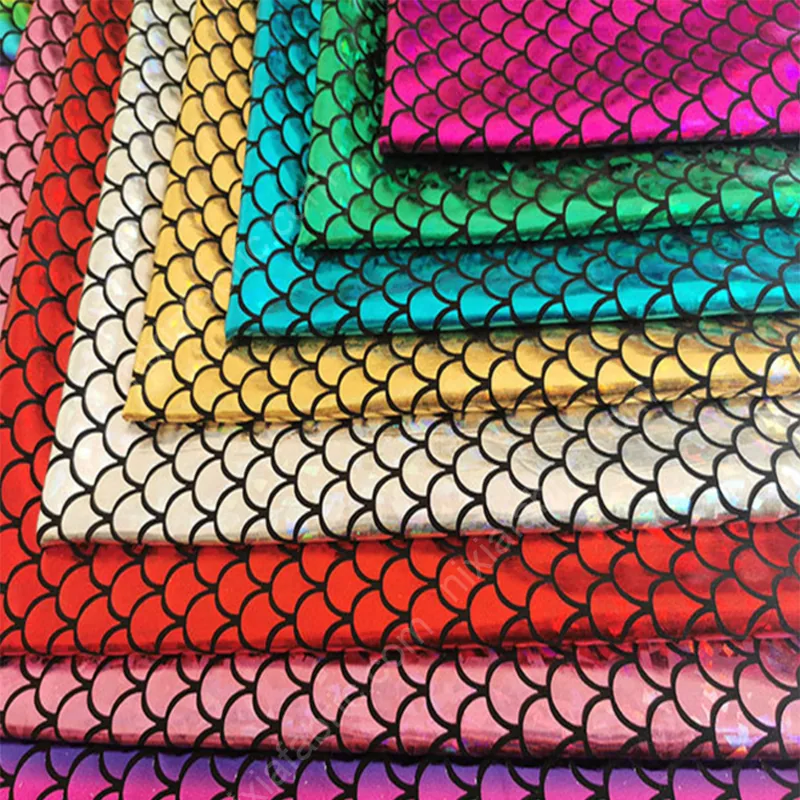 Holographic mermaid scale stretch fabric color and shine detail for dancewear buyers