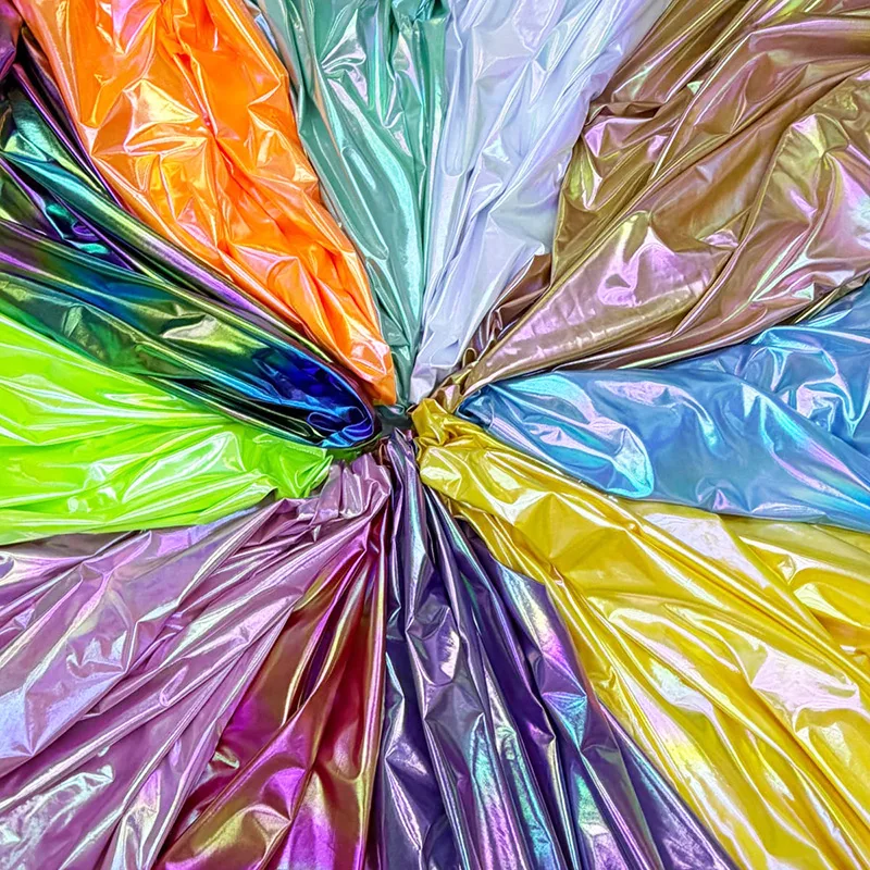 Iridescent gradient stretch fabric close-up for dancewear manufacturers