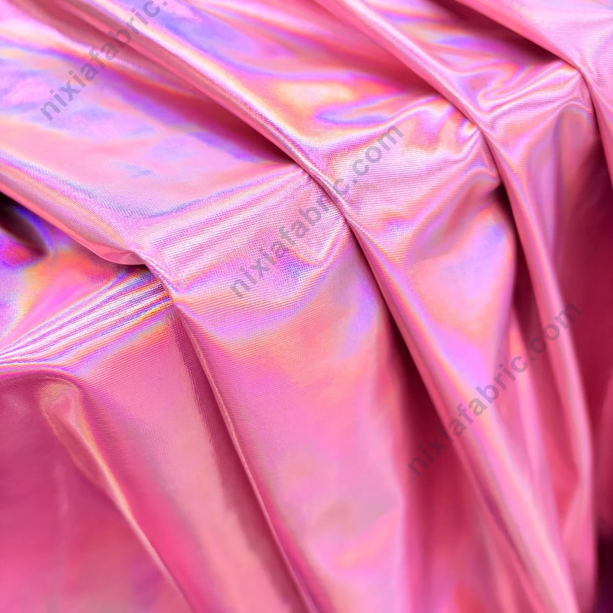 Close-up of pink-purple iridescent laser foil finish on 4-way stretch fabric