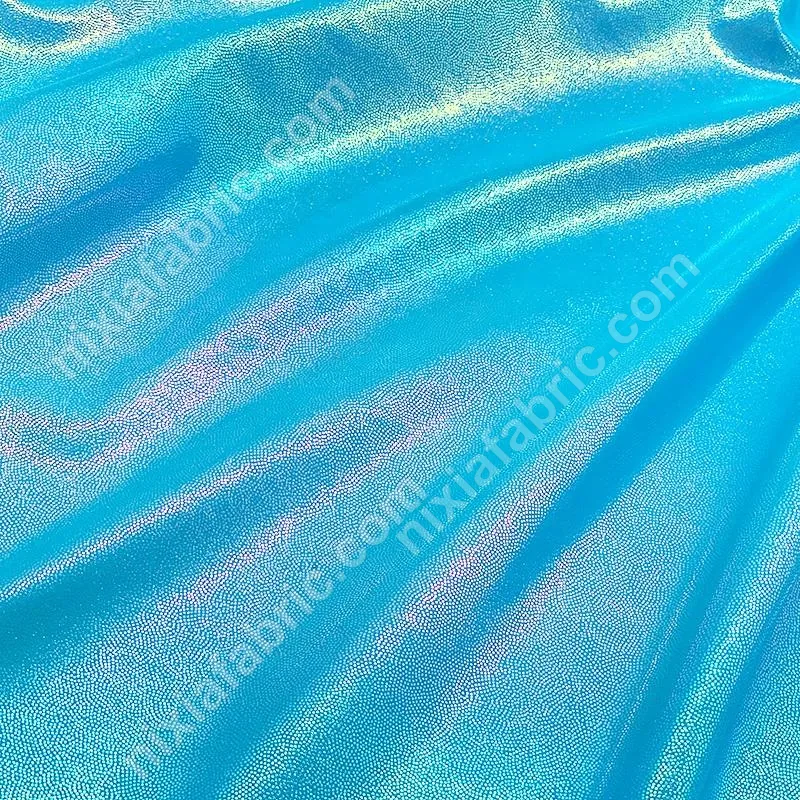 Iridescent mystic metallic foil nylon spandex fabric close-up surface
